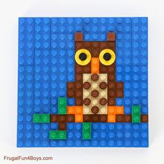 an image of a lego owl made out of blue and brown bricks with yellow eyes