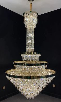 The European empire-style crystal chandelier is an artwork of craftsmanship and beauty. This chandelier consists of two parts: the upper part is numerous crystal rods in the shape of a rectangle, regularly arranged like a long neck; the lower main part is like a huge crystal bowl or an inverted dome with a layered look, trimmed with circles of metal as a framework. You will fall in love with this crystal chandelier once you see it online, or even more when installed in your staircase, hallway, d High Ceiling Foyer, Staircase Hallway, Shenzhen City, Huge Crystal, Foyer Hallway, Metal Light Fixture, Hallway Entryway, Stainless Steel Lighting, Crystal Bowl