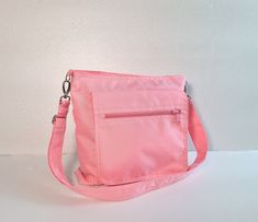 "Please check 'shop announcement' for production time and delivery before your purchase.  This bag is made from pink water-resistant nylon, a sturdy and durable material. It is big enough to hold lots of your essentials and a mini iPad.  If you prefer this style in different colors, you can see color samples from my other  listings : http://www.etsy.com/shop/tippythai?section_id=5879767. Please leave your color request in \"note to seller\" box while ordering. A top zipper closure keep all of yo Travel Bag Women, Pink Water, Bag Travel, Color Samples, Messenger Bags, Bag Women, Travel Bag, Zipper Pocket, Messenger Bag