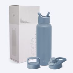 a blue water bottle next to a white box and an empty container for thermos