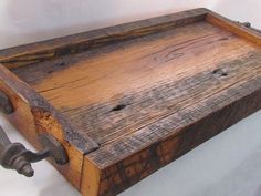 an old wooden box with metal handles