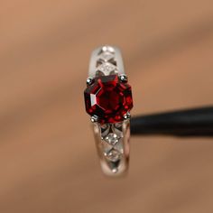 It is a natural garnet ring, octagon cut, measures 7mm*7mm, weight about 2.48 cts. The basic metal is sterling silver and plated with rhodium.To change the metal to a solid gold (white/rose) or platinum is also available, please ask for a quotation if you want.You can also go to my shop Home for more elegant rings: https://www.etsy.com/shop/godjewelry?ref=hdr_shop_menuGarnet is birthstone of January.More Garnet rings:https://www.etsy.com/shop/godjewelry?ref=seller-platform-mcnav&section_id=2 Elegant Emerald Cut Lab-created Ruby Jewelry, Elegant Emerald-cut Lab-created Ruby Jewelry, Silver Octagon Crystal Promise Ring, Octagon Shaped Sterling Silver Topaz Ring, Red Asscher Cut Diamond Jewelry, Asscher Cut Ruby Fine Jewelry, Asscher Cut Ruby Ring Gift, Emerald Cut Garnet Promise Ring, Garnet Emerald Cut Promise Ring