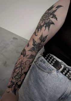 a woman with a flower tattoo on her arm