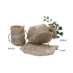 two burlap bags with green plants in them on a white background, one bag is empty and the other has a plant growing out of it's leaves