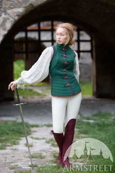 Ladies Cotton Gambeson Vest "Dark Star" for sale | Underarmour padding store ArmStreet.com. Available in: dark blue cotton, green cotton, black cotton, blue cotton, burgundy cotton, brown cotton, dark blue cotton, green cotton, black cotton, blue cotton, burgundy cotton, brown cotton :: by medieval store ArmStreet Costume Reference Photo, Woman Reference Full Body Pose, Medevial Outfits Women, Gambison Medieval, Woman In Dress Reference, Lasso Pose, Aketon Medieval, Woman With Staff, Royalty Poses