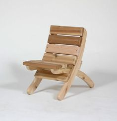 a wooden chair sitting on top of a white floor