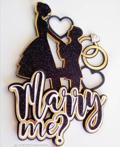 a cake topper that says marry me? with a silhouette of a man and woman holding hands