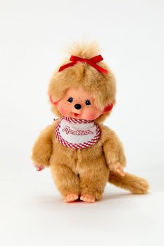 a teddy bear with a scarf around it's neck is posed on a white background