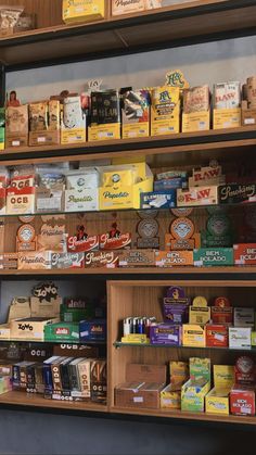 the shelves are full of different types of liquors and coffee drinks in boxes on them