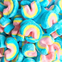 a pile of blue, yellow and pink marshmallows