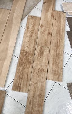 several different types of wood flooring laying on the ground