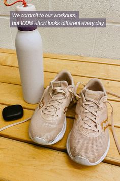 there is a pair of shoes next to a water bottle on the bench with an inscription that reads we commit to our workouts, but 100 % off not looks different every day