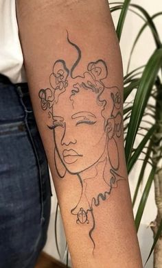 a woman's arm with a tattoo on it