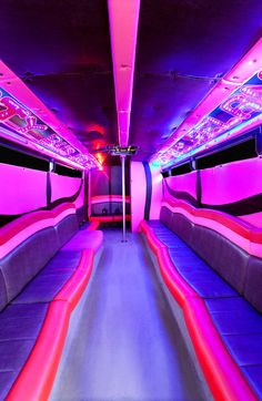 the inside of a party bus with neon lights