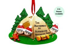 a christmas ornament with an image of two people in a tent and the words the whitmores at algon