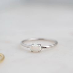 Made of Sterling Silver 14K Gold or Rhodium plating Nickel-free & Hypoallergenic Highest grade lab created opals Available in sizes 4-10 Minimalist Opal Birthstone Promise Ring, Oval Opal Ring, Engagement Survey, Opal Solitaire Ring, Wedding Bands For Him, Wedding Bands For Her, Jewelry Repair, Opal Ring, Fine Rings