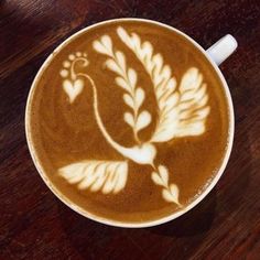 a cappuccino with an intricate design on it