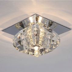 a close up of a ceiling light with a diamond shaped object on it's side