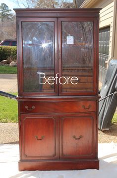 an old china cabinet with the words before painted on it