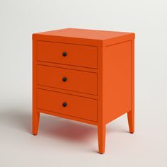 an orange dresser with three drawers on one side and two black knobs on the other