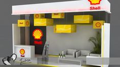 a shell gas station is shown with yellow lights hanging from it's ceiling and furniture in the foreground