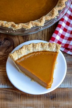 a slice of pumpkin pie on a plate