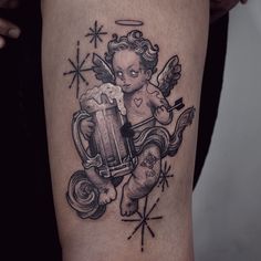 a tattoo with an angel holding a beer mug