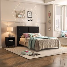 a bed room with a neatly made bed next to a night stand and window sill