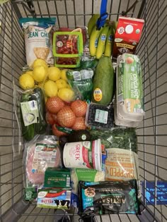 a shopping cart filled with lots of food