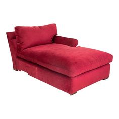 a red chaise lounge chair sitting on top of a white floor