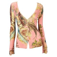 Presenting a pink pheasant print Roberto Cavalli cardigan. From the Spring/Summer 2003 collection, this print first debuted on the season's runway in yellow on look number 11 on Amanda Moore and in the ad campaign on Kamila Szczawińska, shot by Mario Testino. This knit button up cardigan features a deep neckline, slit cuffs with dangling gold embellishments, and shiny gold colored buttons. One of the most sought after patterns from the early 2000s, this cardigan is the perfect casual piece to add to any wardrobe. Approximate measurements: 25" shoulder to cuff 18" armpit to cuff Top Transparente, Pink Chinoiserie, Chinoiserie Print, Cardigan Rosa, Digital Dress, Number 11, Mario Testino, Style Clothes, Deep Neckline