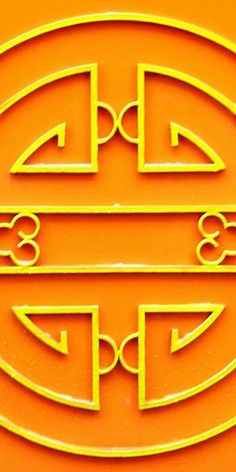 an orange and yellow sign with two circles in the shape of letters that are interlocked