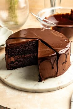 a chocolate cake with one slice missing from it