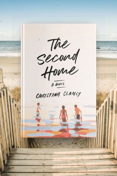 the second home by christmas clancey is shown in front of stairs leading to the beach