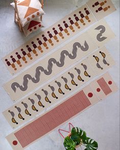 several different types of decorative tape sitting on top of a table next to a potted plant