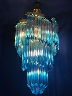 a blue chandelier hanging from the ceiling