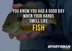 a person holding a fish in their hand with the caption, you know you had a good day when your hands smell like fish