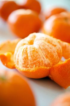 peeled oranges sitting on top of a table