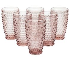 a set of six pink glasses sitting next to each other