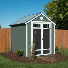 a small shed in the middle of a yard