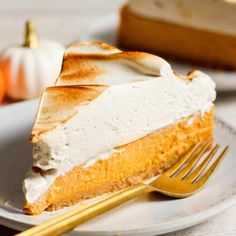 a slice of pumpkin pie on a plate with a fork