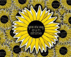 a yellow sunflower with the words you are my sunshine on it's center surrounded by black and white circles