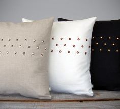 Studded Pillow: Edgy. Modern. Sophisticated. Each nailhead is hammered by hand to adorn this natural linen pillow cover in a sleek polka dot pattern. Original design by artist and interior designer, Jillian Carmine.Material: Linen and Copper Metal NailheadsSize:20" x 20" (50.8cm x 50.8cm)Handmade in the USA.*Insert NOT Bantal Sofa, Trendy Sewing, Sewing Pillows, Trendy Bedroom, Linen Pillow Covers, Pillows Decorative, Geometric Pillow, Simple Bedroom, Cushion Pillow