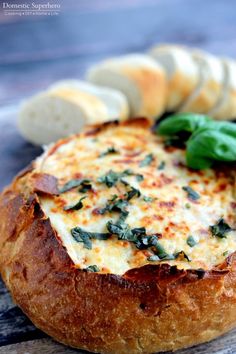 some bread with cheese and spinach on it