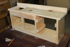 a wooden workbench is being built with tools