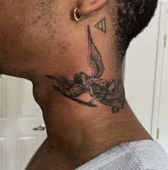 a man with a tattoo on his neck