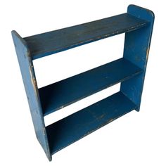 a blue shelf with two shelves on each side