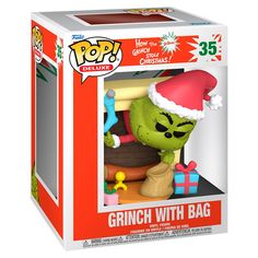 the grinch with bag pop vinyl figure is in its christmas gift box, wearing a santa's hat