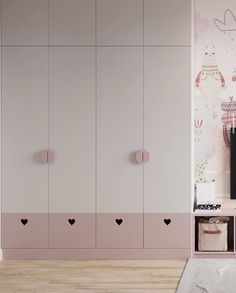 a pink and white closet with hearts painted on the wall, next to a tv