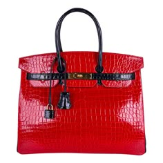 Mightychic offers a dramatic Hermes Birkin HSS 35 bag featured in Braise and Black porosus crocodile. This extraordinarylimited edition Hermes Birkin bag is simply show stopping. Lush gold hardware. Black interior. This bag is in superior condition. Plastic on hardware. Comes with lock, keys, clochette, sleeper, signature Hermes box. final sale BAG MEASURES: LENGTH 35 cm / 14" TALL 28 cm / 11" DEEP 18 cm / 7" HANDLES: TALL 5" CONDITION: LIKE NEW Summer Designer Bags, Hermes Birkin Ostrich, Hand Purse For Women, Luxury Handbags Louis Vuitton, Leather Bag Women Handbags, Crystal Method, Bags Expensive, Expensive Purses, Luxury Handbag Collection